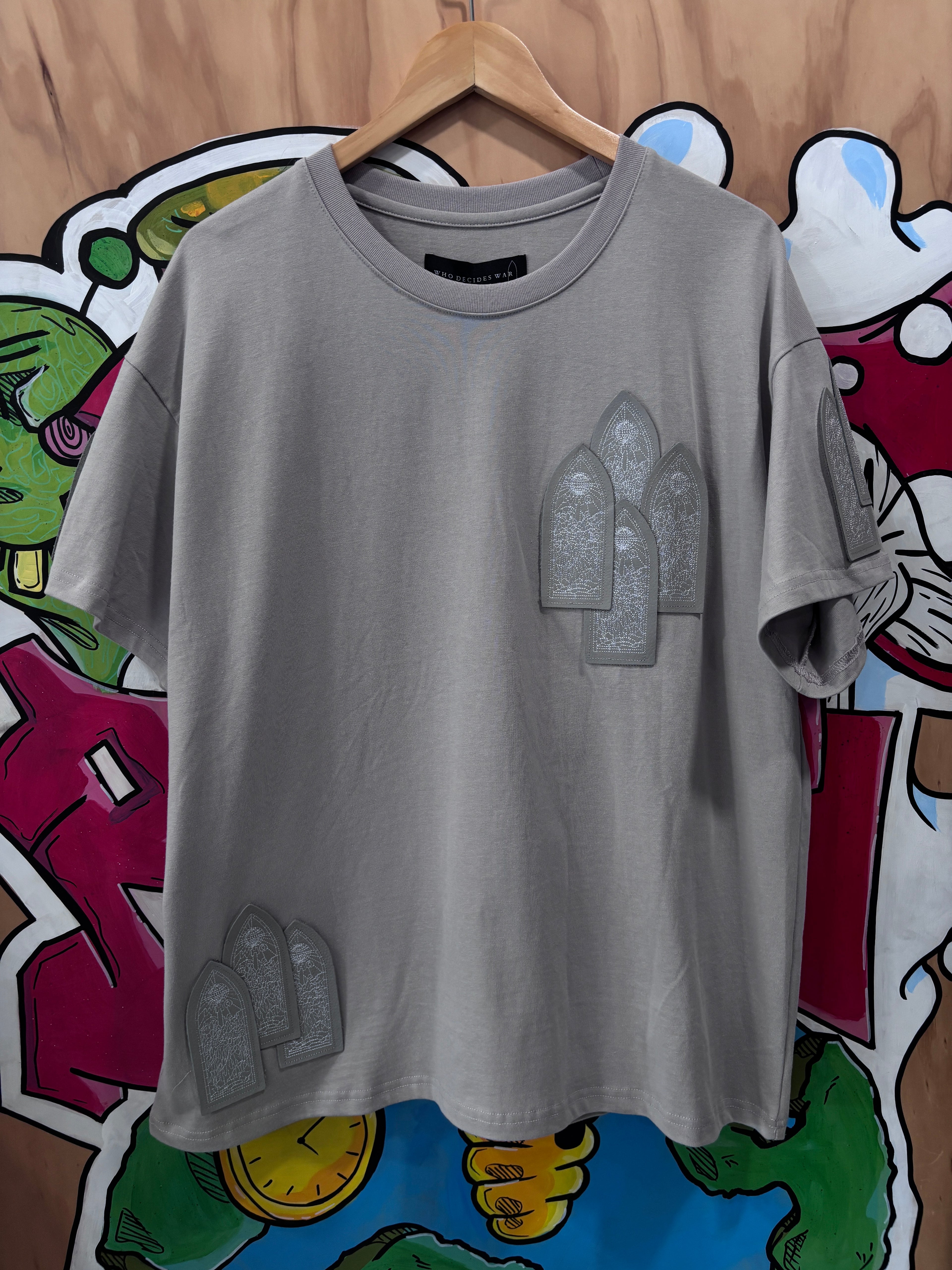 Who Decides War Leather Window Tee